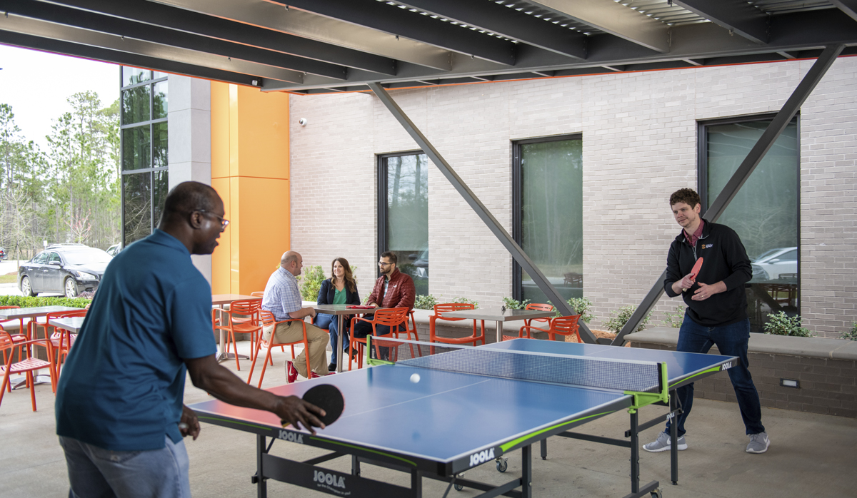 Globalstar employees playing ping pong