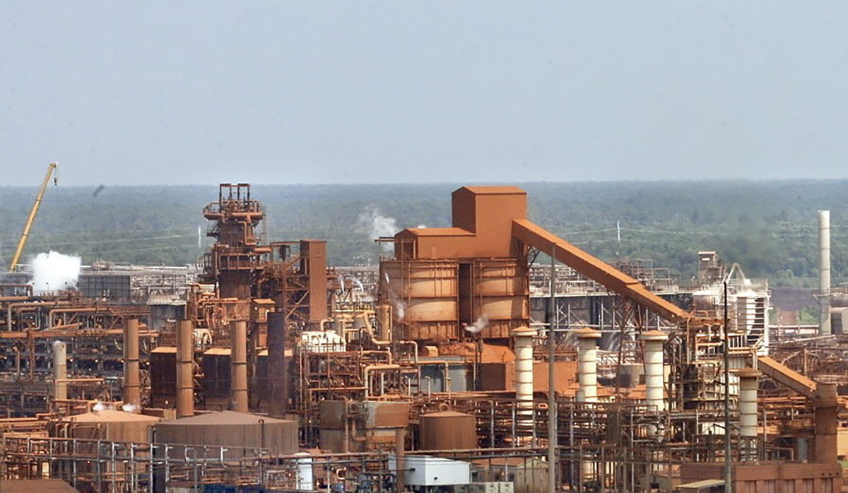 Noranda Alumina Plant with blue sky in background image