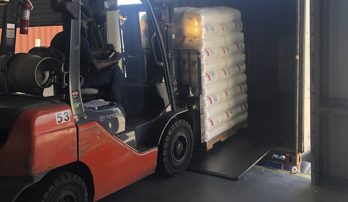 TCI Packaging Employee loading a truck with a forklift