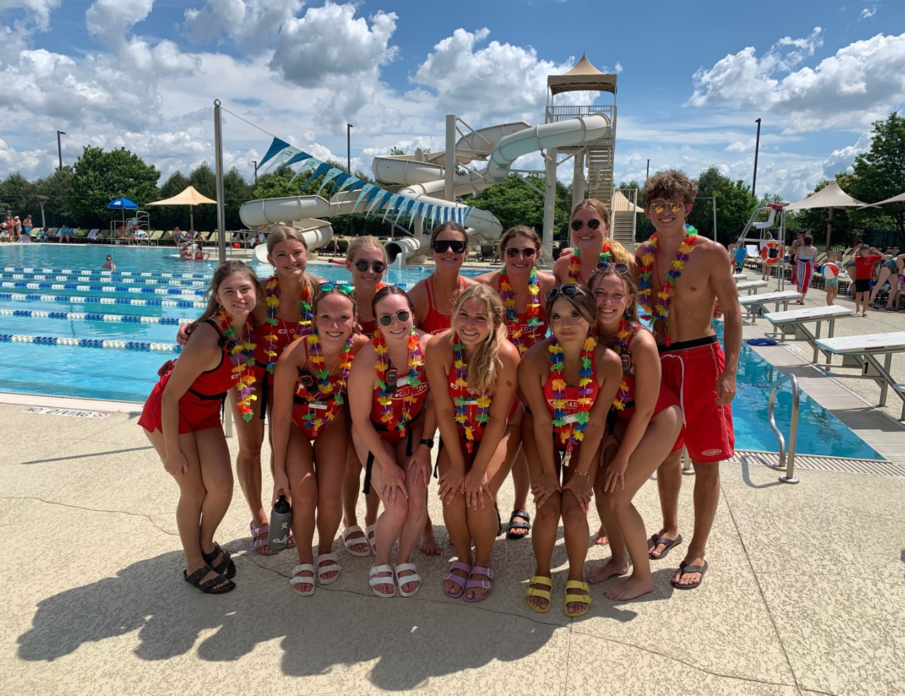 Life Time lifeguards group photo at the outdoor pool.