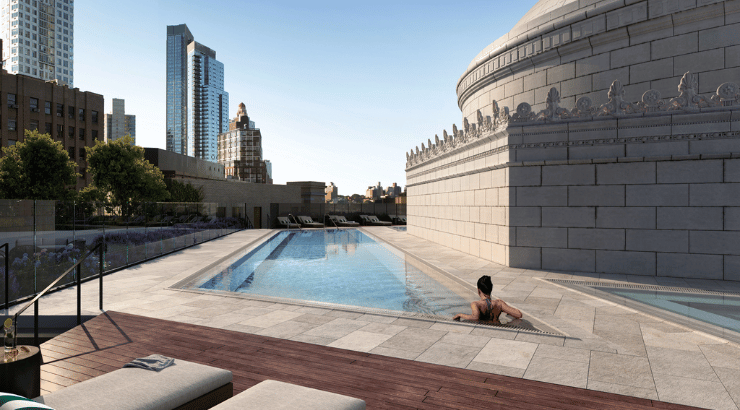 Life Time outdoor pool on the rooftop of Life Time Brooklyn overlooking New York skyline.