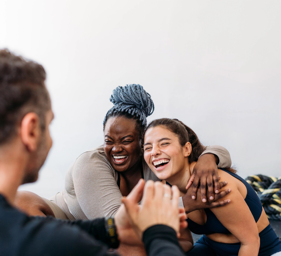 Life Time interns smiling and laughing together at the Life Time corporate office. 