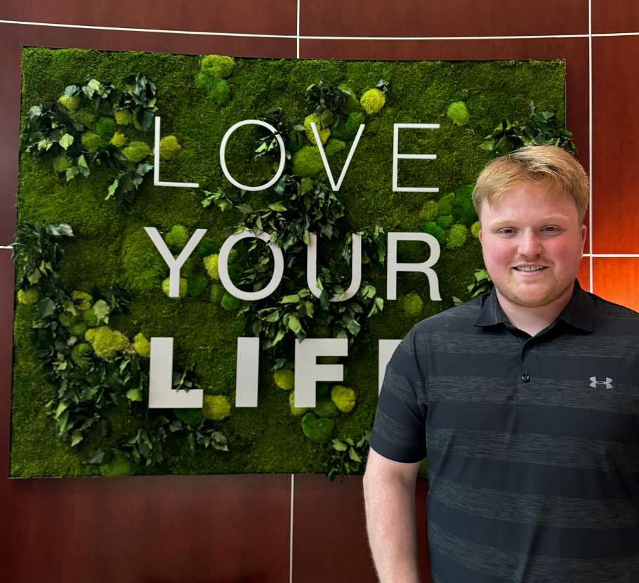 Male, Public Relations Manager standing outside Life Time Corporate Office.