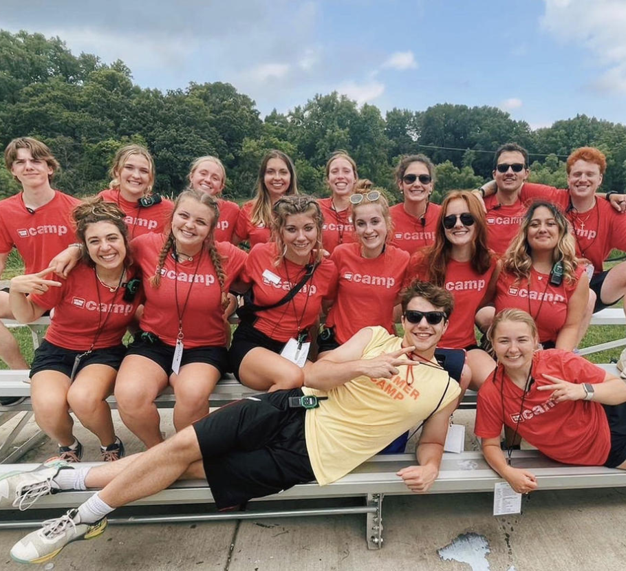 Life Time kids camp counselors all taking a picture together outside.
