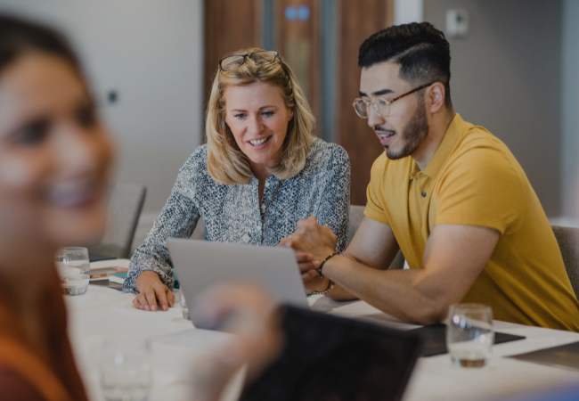 Two Life Time team members working together on event planning at Life Time.