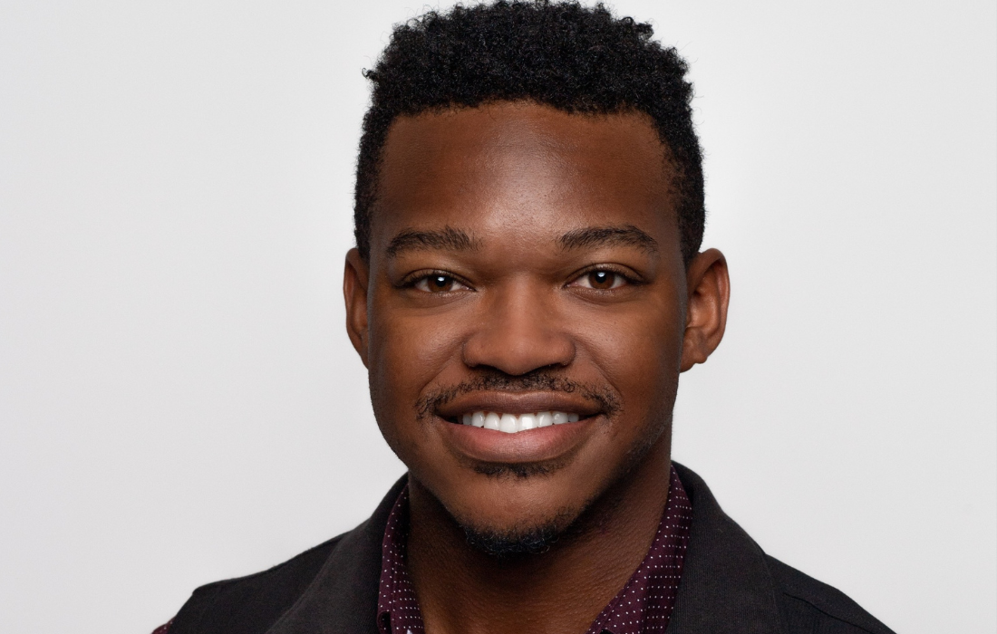 Male Life Time construction team member smiling at the camera.