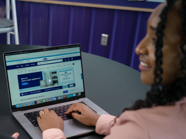 Lowe's associate working on her laptop