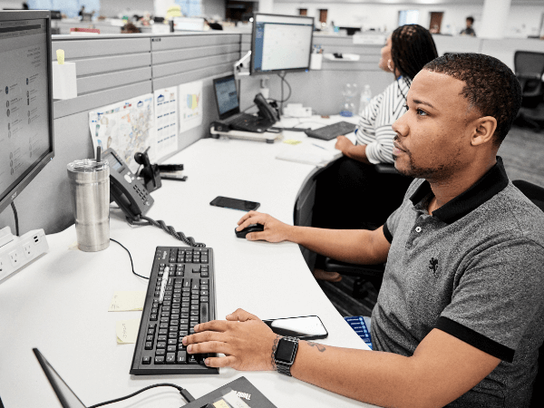 Male associate working at his desk