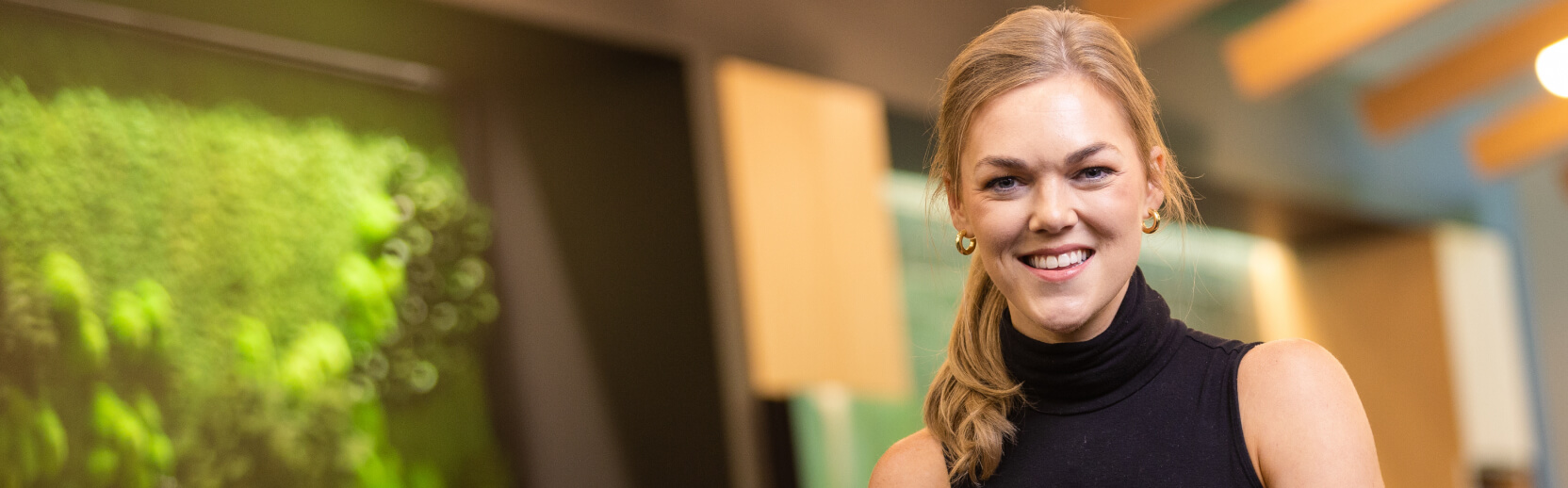 Associate smiling intently while working at Corporate headquarters