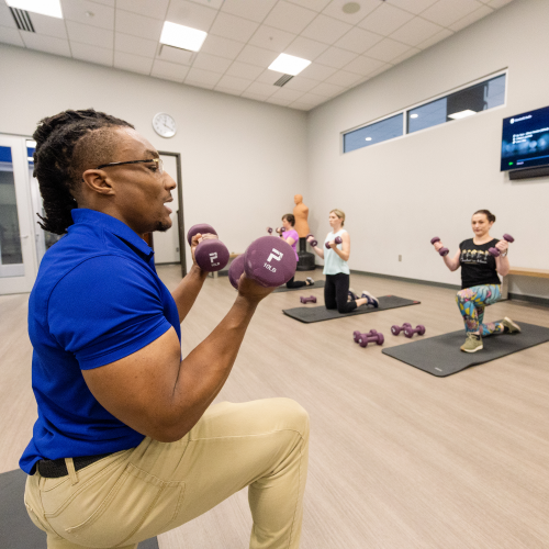 Lowe's associates working with a personal trainer at Corporate headquarters