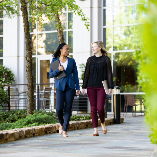 Lowe's associates talking and walking outside Corporate headquarters