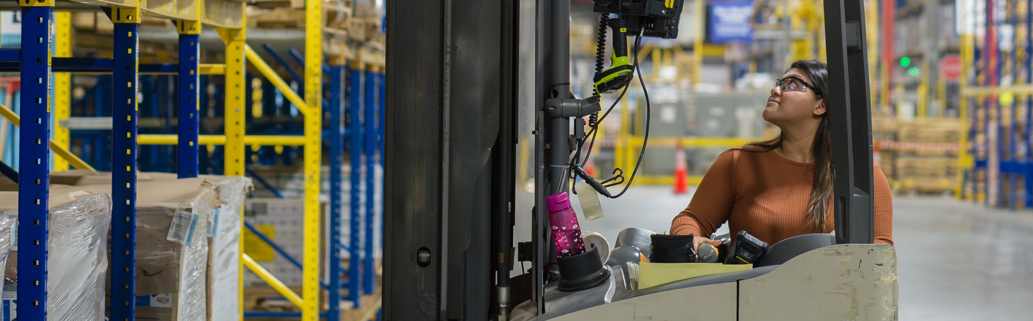 Supply Chain team member operating a forklift