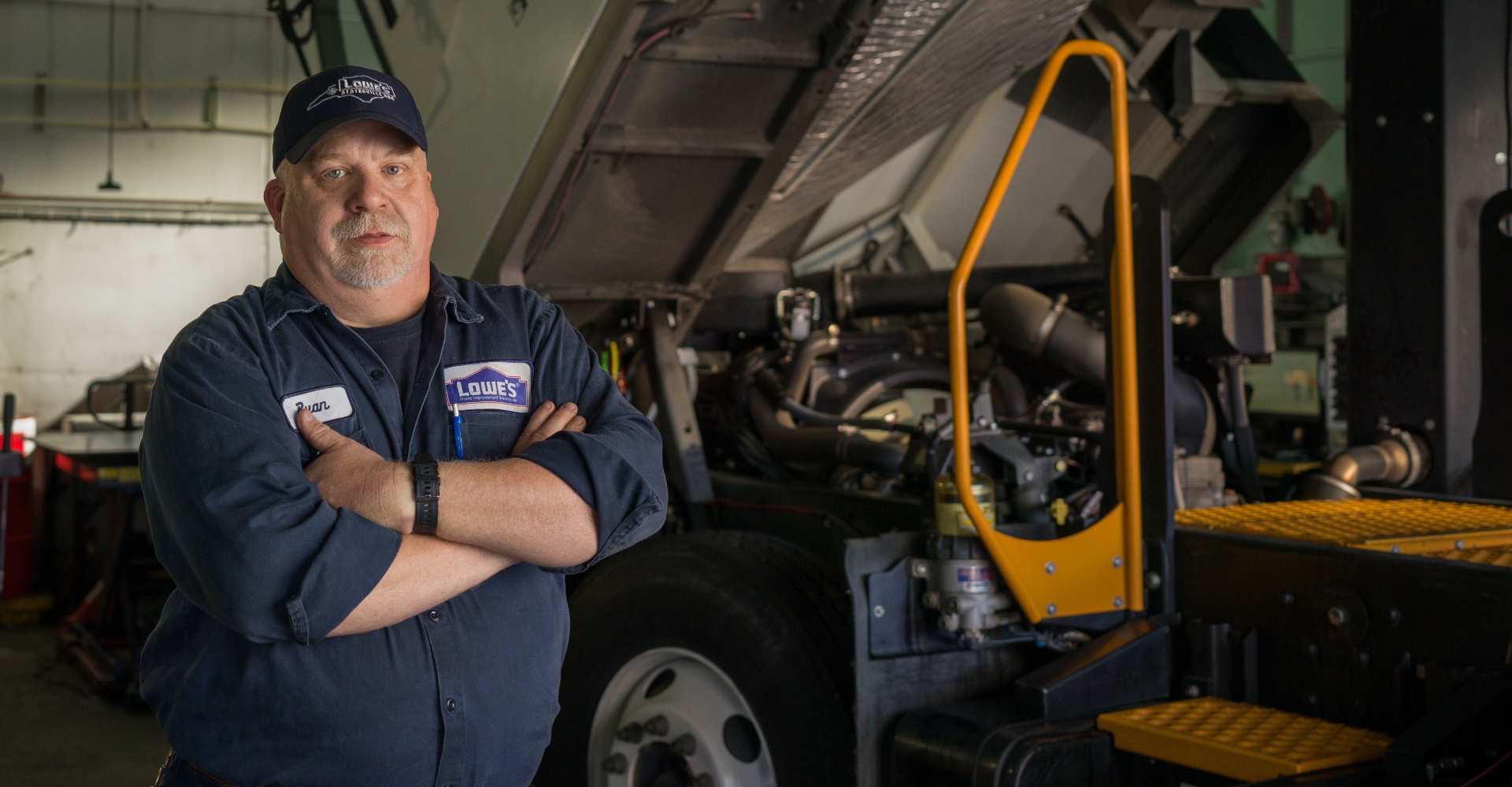 Lowe's mechanic working on a truck