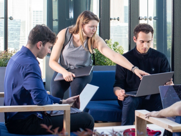 Associates working together outside at the Tech Hub