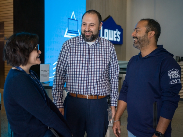 Group of Tech associates having a conversation in the Tech Hub