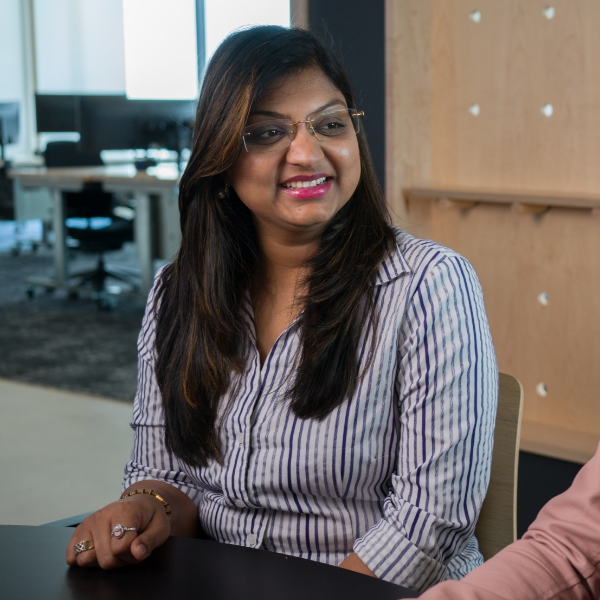 Female associate meeting with colleagues