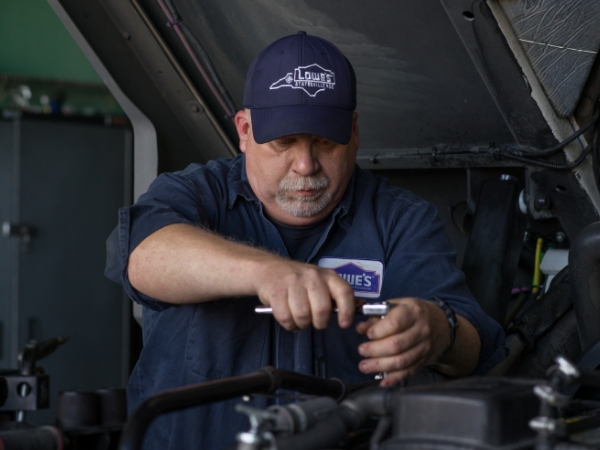 Supply Chain mechanic working on a truck