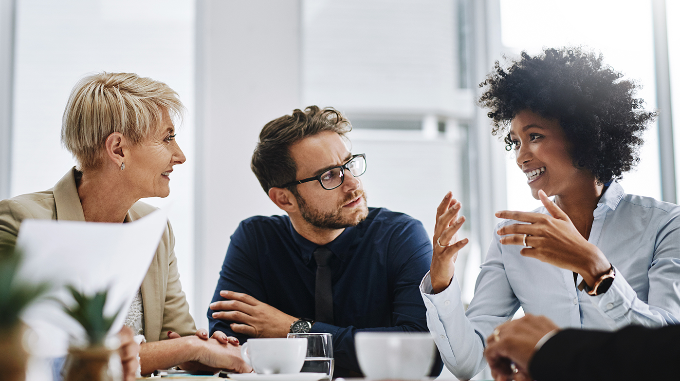 Employees discussing at a table