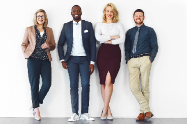 Four colleagues posing for a picture