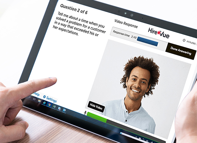 Image of an tablet with HireVue application open with a headshot image of a potential candidate.