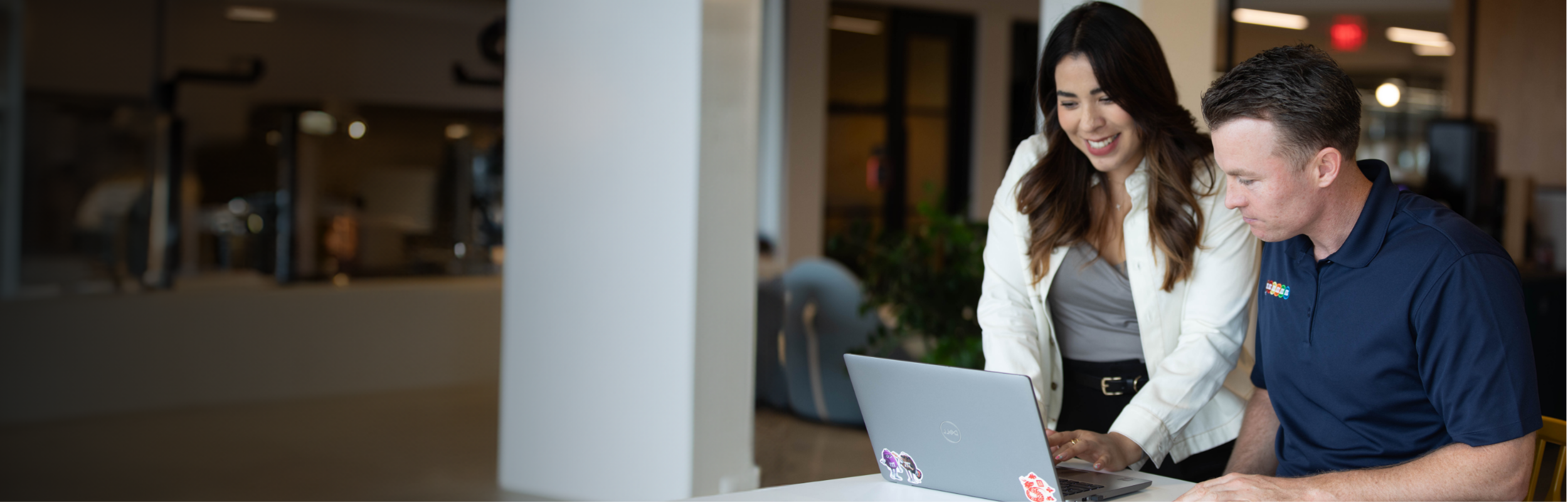 Two Associates working together from a laptop