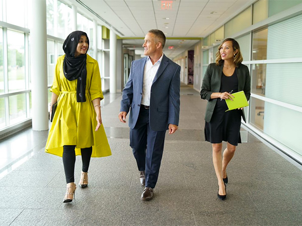 Diverse group people talking in office