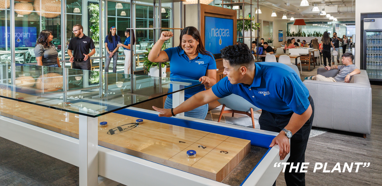 Niagara team members playing foosball at HQ 