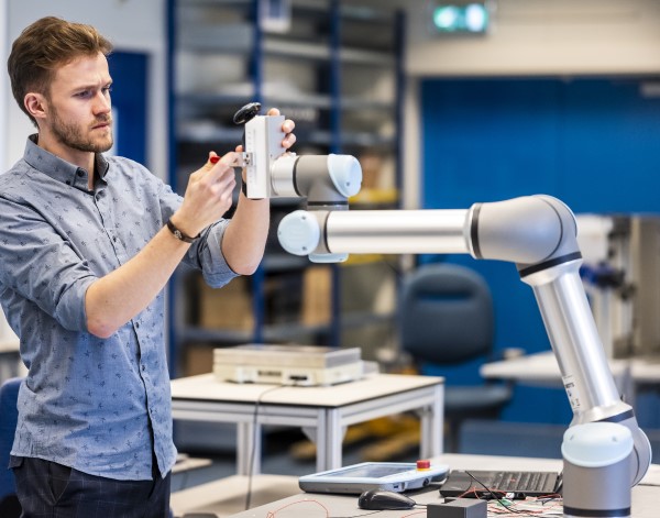 A young engineer at Philips tinkers with a medical device