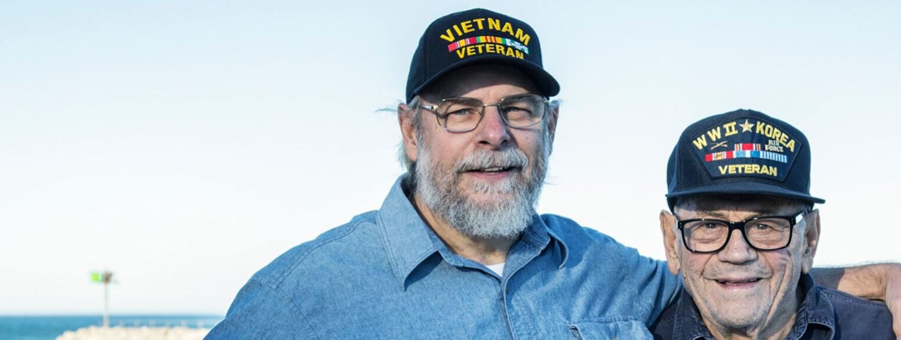 Two veterans smiling for a picture.