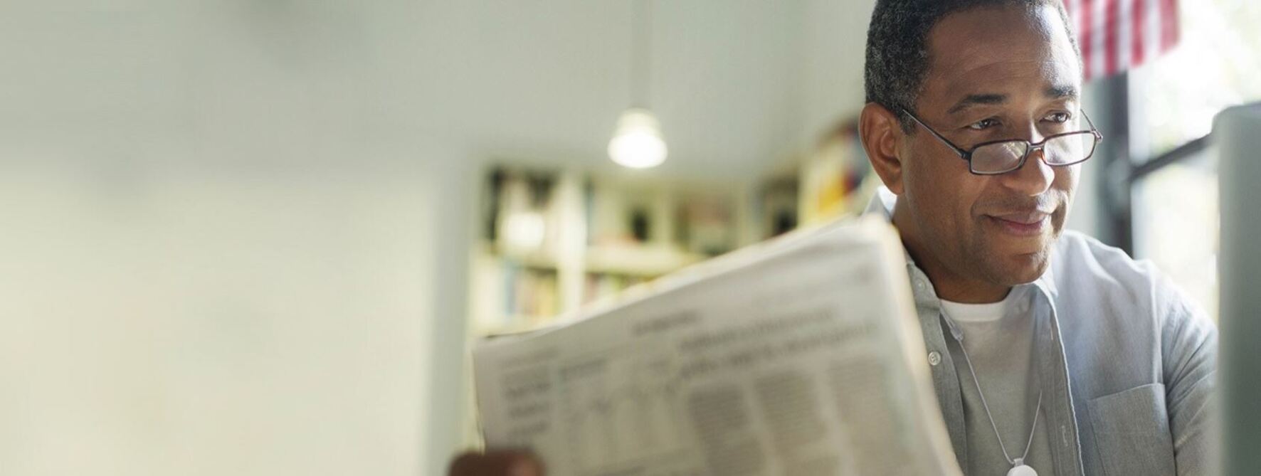 Man reading a newspaper.