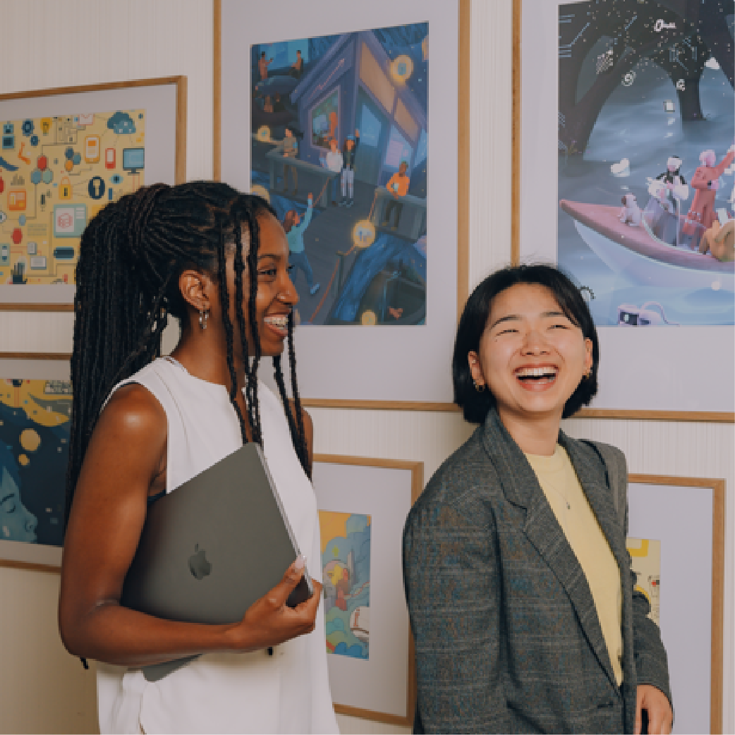 Girl smiling with computers