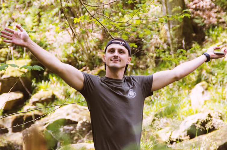Dean with his arms outstretched