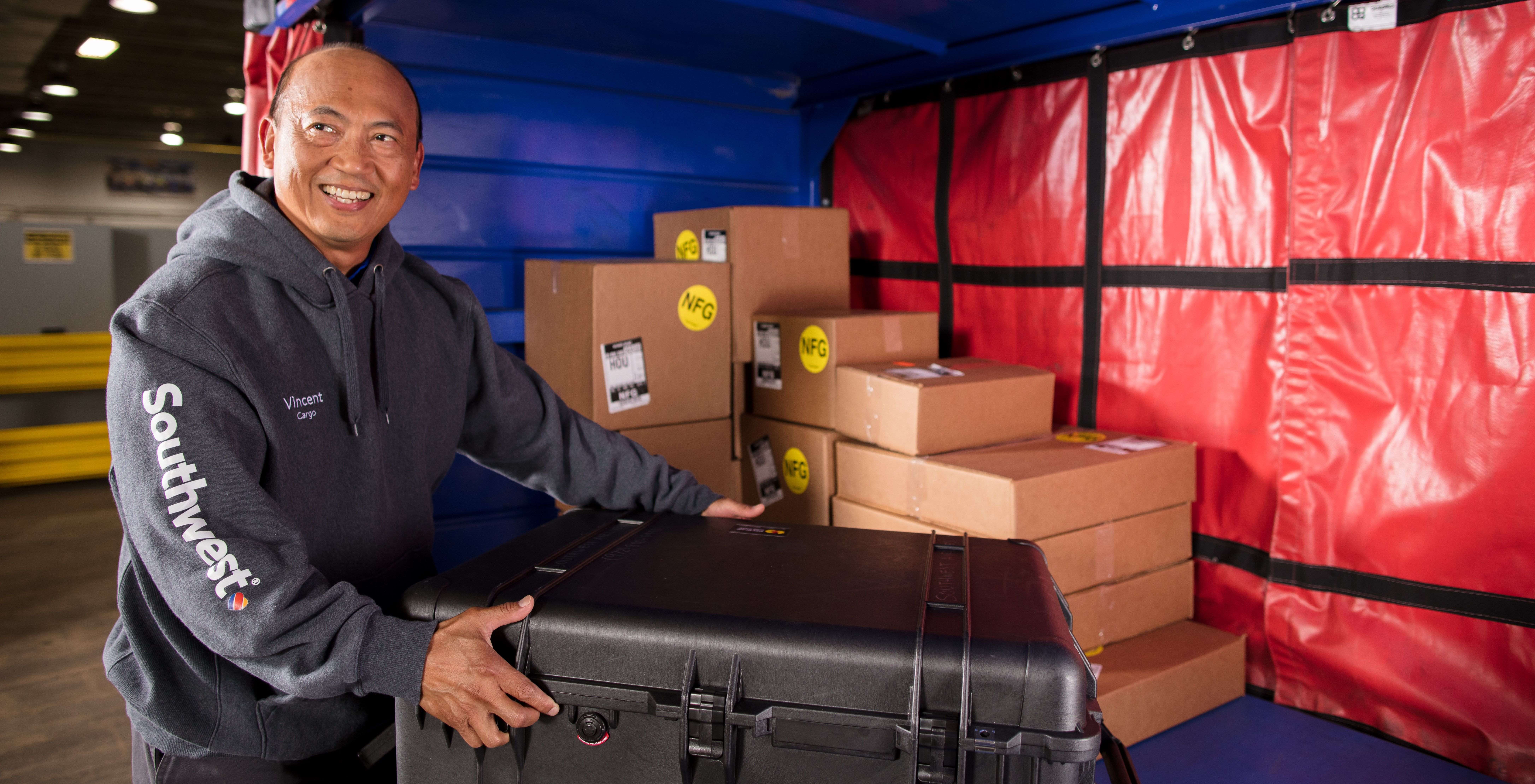 Cargo Agent smiling holding cargo,