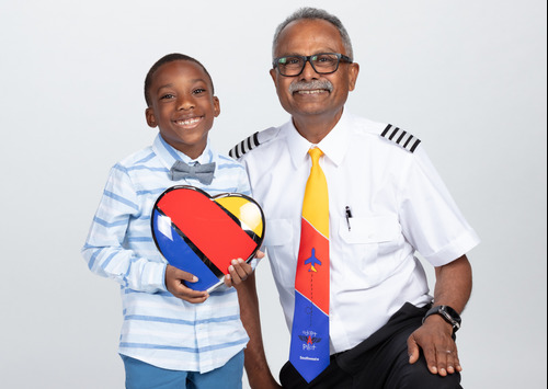 Southwest Pilot smiling with a student from the Adopt-A-Pilot program.