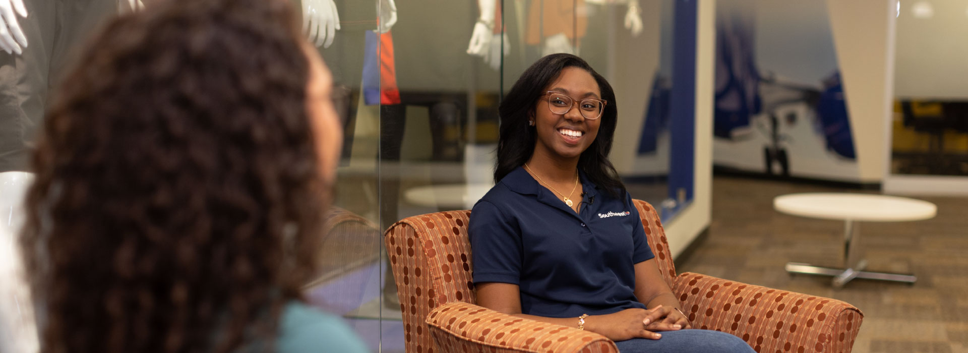 A Campus Reach coordinator smiling at her coworker