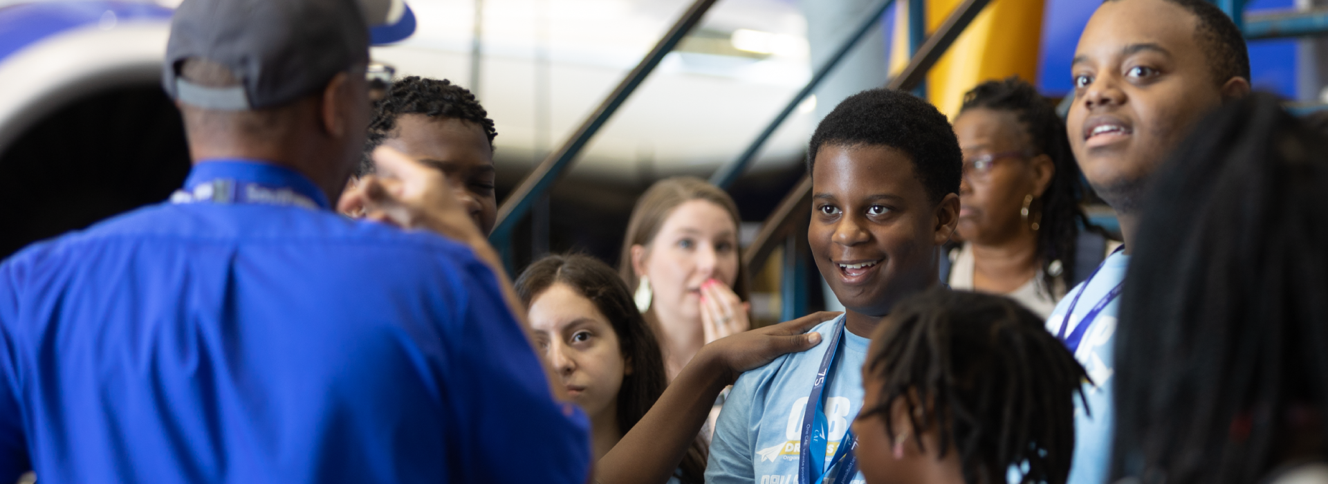 A young student talking with a Southwest Airlines Employee