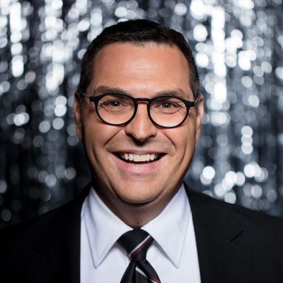 Headshot of VP of Ground Operations, Chris Johnson in front of a grey background. Chris started as a Ramp Agent in Detroit.