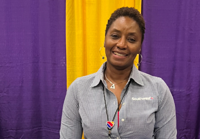 Photo of Eureka D. smiling at a recruiting event