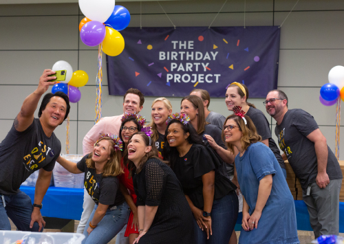 A group of Southwest employees taking a selfie at a birthday party