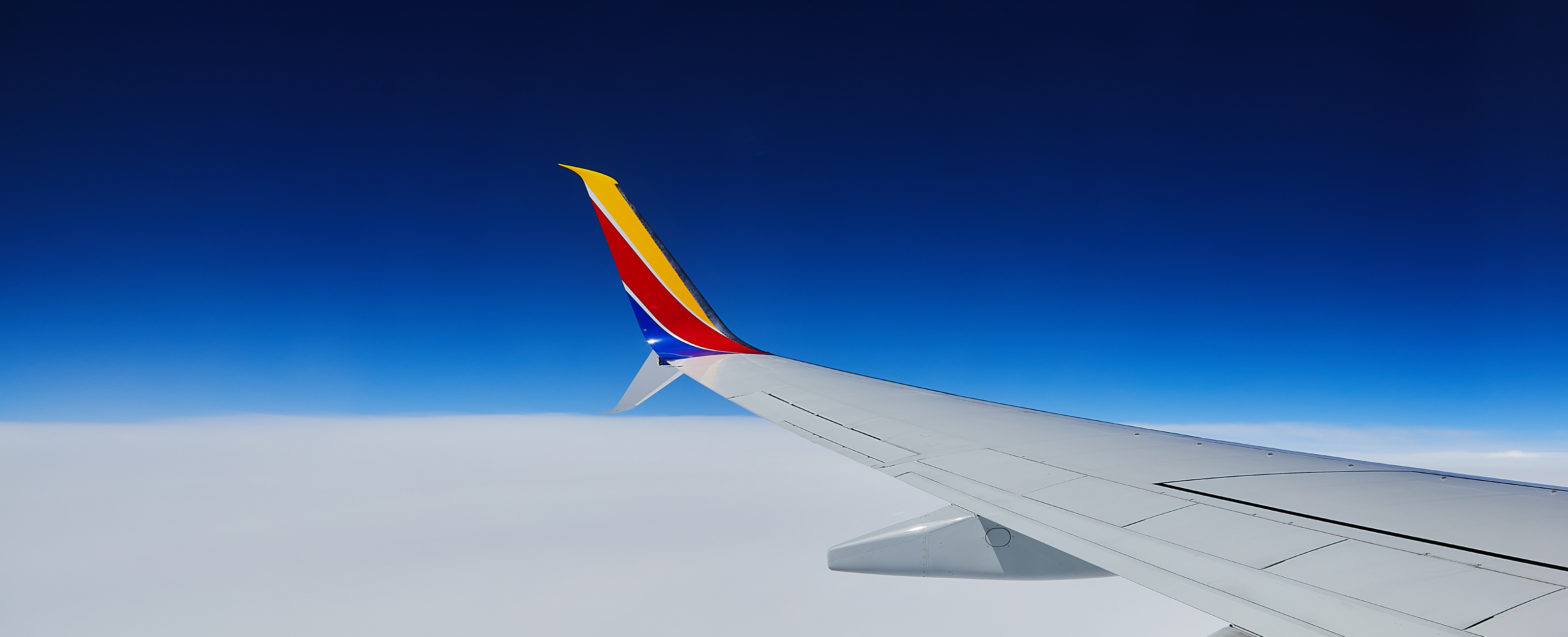 A Southwest plane flying above the clouds