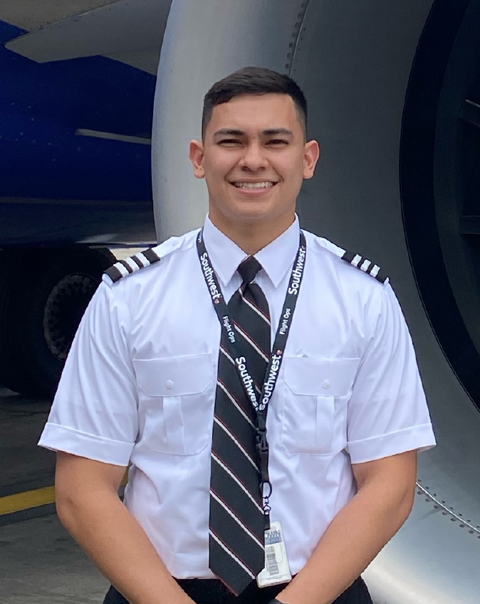 First Officer Jesus C. smiling in front of a Southwest 737