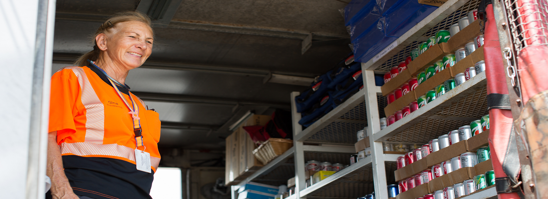 Provo Agent smiling and loading soda into an airplane