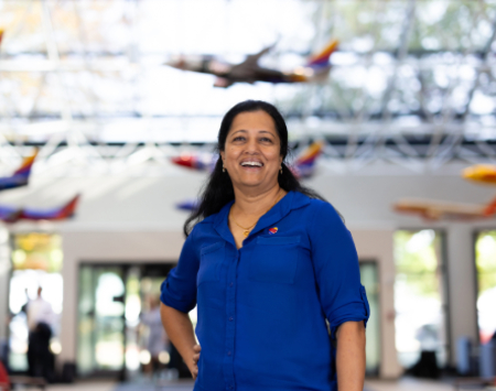 Southwest Employee smiling at the camera in our headquarters lobby.