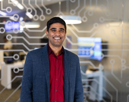 Southwest Employee smiling in front of a technology background. 