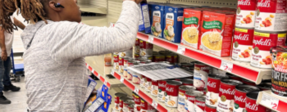 Travel Merchandiser stocking shelves