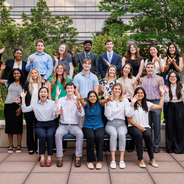 Group of Veritiv interns waving and smiling