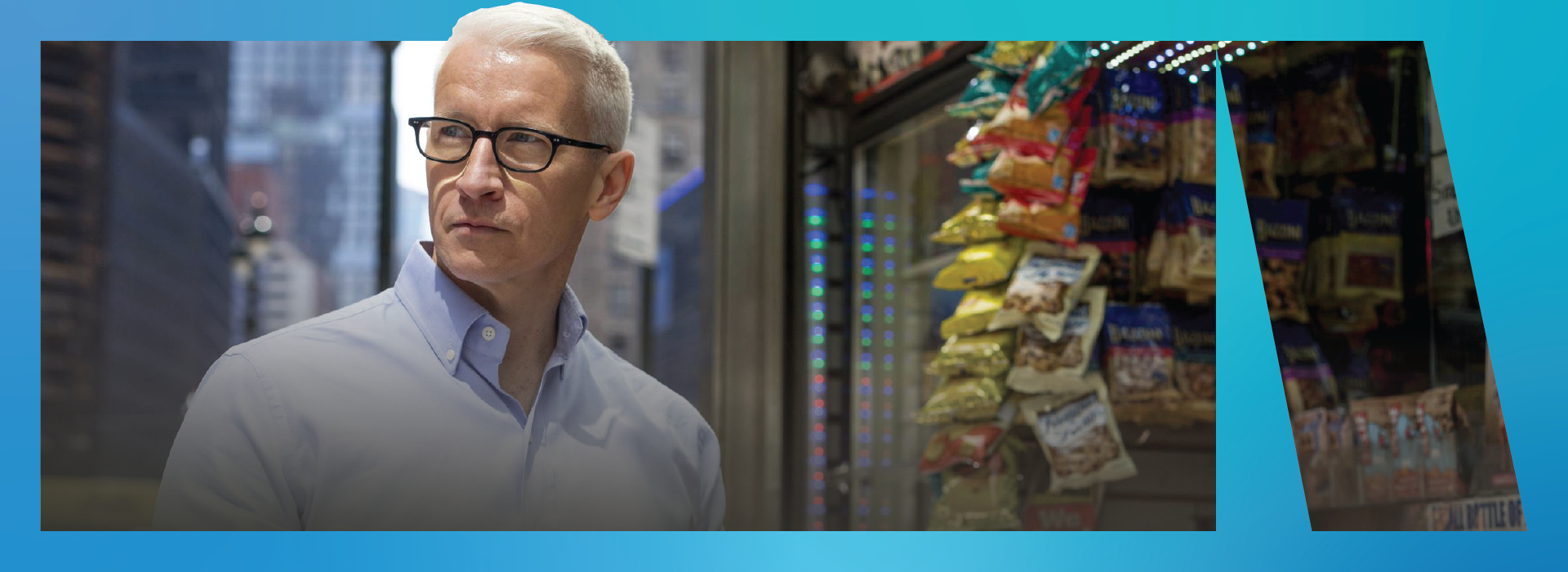 Anderson Cooper staring off into a distance next to a bodega.
