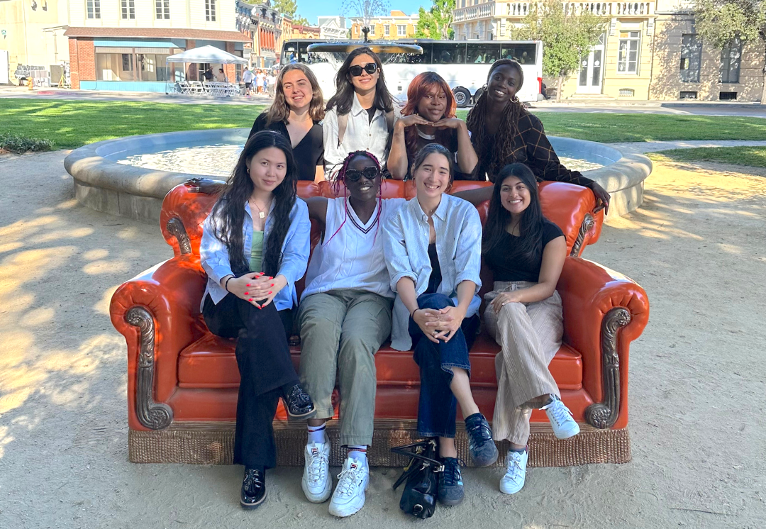 Current and Former interns sitting on the Friends Couch on the Lot in Burbank, CA.